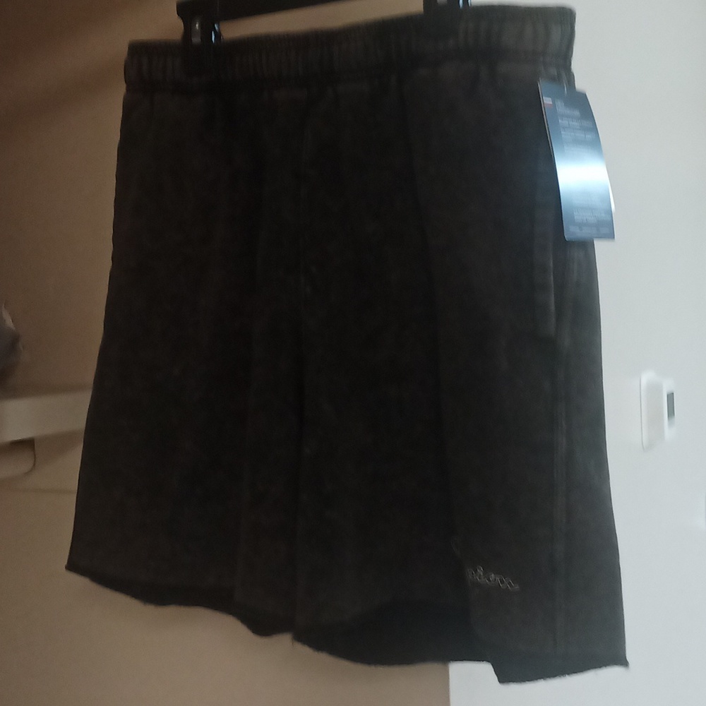 Brand new Champion shorts size large. Black with a cream colored acid wash